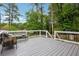 Relax on this outdoor deck with its gray paint and serene wooded view, perfect for entertaining at 2240 Clanton Ter, Decatur, GA 30034