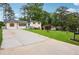 Lovely white brick house with a long driveway, green lawn, and inviting curb appeal at 2240 Clanton Ter, Decatur, GA 30034