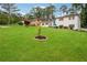 Beautifully landscaped front yard featuring a white brick home and well-maintained lawn at 2240 Clanton Ter, Decatur, GA 30034
