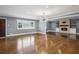 Bright and spacious living room with hardwood floors, a stone fireplace, and large windows at 2240 Clanton Ter, Decatur, GA 30034