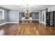 Elegant living room with an open floor plan, modern appliances, fireplace, and hardwood floors at 2240 Clanton Ter, Decatur, GA 30034