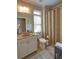 Well lit bathroom featuring neutral colors, granite countertops, and shower curtains for privacy at 2771 Middlecreek Way, Cumming, GA 30041