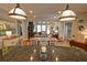 Open concept dining area with a view into the kitchen and living room at 2771 Middlecreek Way, Cumming, GA 30041