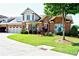 Charming brick townhome with well maintained landscaping, inviting curb appeal and attached garage at 2771 Middlecreek Way, Cumming, GA 30041