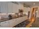 Gourmet kitchen featuring white cabinets, granite countertops, subway tile backsplash, and stainless appliances at 2771 Middlecreek Way, Cumming, GA 30041