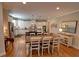 Elegant kitchen featuring stainless steel appliances, white cabinetry, and a center island, seamlessly connected to the dining area at 2771 Middlecreek Way, Cumming, GA 30041