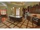 Gourmet kitchen with a large center island, stainless steel appliances, and custom wood cabinetry at 2771 Middlecreek Way, Cumming, GA 30041