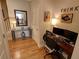 Bright office space features hardwood floors, a modern desk setup, and stylish decor at 2771 Middlecreek Way, Cumming, GA 30041