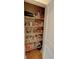 Pantry has wire shelving stocked with dry goods, canned goods, condiments, and snacks at 2771 Middlecreek Way, Cumming, GA 30041