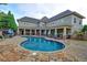 Gorgeous community pool with plenty of seating and beautiful pavers at 2771 Middlecreek Way, Cumming, GA 30041