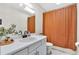 Bright bathroom featuring a single sink vanity, and a shower with patterned curtain at 387 Rose Creek Pl, Woodstock, GA 30189