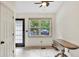 Bright breakfast nook with a large window overlooking the backyard and a vintage drop leaf table at 387 Rose Creek Pl, Woodstock, GA 30189