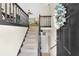 Inviting entryway with staircase leading to the upper level at 387 Rose Creek Pl, Woodstock, GA 30189