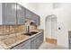 Stylish kitchen with modern appliances, a beautiful backsplash and granite counters at 387 Rose Creek Pl, Woodstock, GA 30189