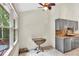Well-lit kitchen with large windows and modern appliances at 387 Rose Creek Pl, Woodstock, GA 30189