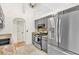 Modern kitchen featuring granite countertops and stainless steel appliances at 387 Rose Creek Pl, Woodstock, GA 30189