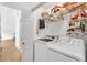 Convenient laundry room with modern washer and dryer units, and plenty of storage space at 387 Rose Creek Pl, Woodstock, GA 30189
