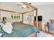 Serene main bedroom showcasing a bed, hardwood floors, and natural light at 387 Rose Creek Pl, Woodstock, GA 30189