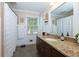 Bright bathroom featuring a granite countertop, white sink, neutral wall paint and shower with matching floors at 690 Glenforest Rd, Sandy Springs, GA 30328