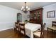 Dining room with classic furniture, hardwood floors, and an elegant chandelier for intimate dinners at 690 Glenforest Rd, Sandy Springs, GA 30328