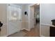 Inviting foyer with hardwood floors, a white door, and an open view to the living areas at 690 Glenforest Rd, Sandy Springs, GA 30328