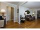 Cozy living room with hardwood floors, stylish furniture, and neutral walls with white trim at 690 Glenforest Rd, Sandy Springs, GA 30328