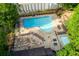 Aerial view of a community pool area with lounge chairs, tables, and a separate wading pool for children at 690 Glenforest Rd, Sandy Springs, GA 30328