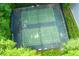 Overhead shot of two community tennis courts surrounded by mature trees and lush greenery at 690 Glenforest Rd, Sandy Springs, GA 30328