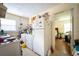 Practical kitchen equipped with white appliances and access to other rooms at 1336 Sharon St, Atlanta, GA 30314