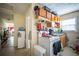 Compact kitchen with essential appliances, cabinet storage, and a view to other rooms at 1336 Sharon St, Atlanta, GA 30314