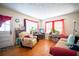 Cozy living room with hardwood floors, bright windows, and comfortable seating at 1336 Sharon St, Atlanta, GA 30314