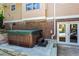 Backyard patio featuring a wooden hot tub with steps up to a door at 2917 Rockbridge Rd, Marietta, GA 30066