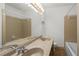 Bathroom featuring a double vanity, tiled shower and large mirror with Hollywood lights at 2917 Rockbridge Rd, Marietta, GA 30066