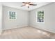 Bright and airy bedroom featuring two windows, plush carpeting and natural light at 2917 Rockbridge Rd, Marietta, GA 30066