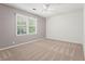 Bedroom with cozy carpet, one window, and neutral paint at 2917 Rockbridge Rd, Marietta, GA 30066