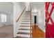 Bright foyer showcasing hardwood floors and a staircase with wooden railings at 2917 Rockbridge Rd, Marietta, GA 30066