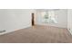 Inviting living room filled with natural light featuring plush carpeting at 2917 Rockbridge Rd, Marietta, GA 30066