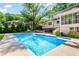 Private backyard with in-ground pool, hot tub, and lush green landscaping at 2917 Rockbridge Rd, Marietta, GA 30066