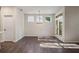 Bright dining room featuring wood floors, neutral paint, modern light fixture and natural lighting at 3564 Arrow Root Cir, Loganville, GA 30052