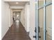 Inviting hallway with dark wood floors leading to the main living area of the home at 3564 Arrow Root Cir, Loganville, GA 30052