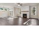 Living room features a fireplace, natural light, and stylish flooring for a welcoming atmosphere at 3564 Arrow Root Cir, Loganville, GA 30052
