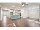 Open-concept floor plan featuring an island kitchen open to the living area and dining area at 3564 Arrow Root Cir, Loganville, GA 30052