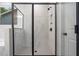 Large walk-in shower featuring marble-look tile and a glass enclosure at 3564 Arrow Root Cir, Loganville, GA 30052