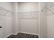 Spacious walk-in closet with ample shelving and hanging space at 3564 Arrow Root Cir, Loganville, GA 30052
