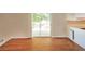 Dining area features hardwood floors and sliding glass doors to deck at 6575 Wendell Cir, Morrow, GA 30260
