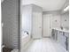 Bathroom featuring a tiled shower, soaking tub, and double sink vanity at 868 Cork Oak Ln, Lawrenceville, GA 30045