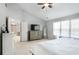 A comfortable bedroom with a ceiling fan and large dresser for storage at 868 Cork Oak Ln, Lawrenceville, GA 30045