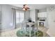Cozy dining area featuring a table for four, natural light, and convenient access to the kitchen and pantry at 868 Cork Oak Ln, Lawrenceville, GA 30045