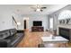Cozy living room with fireplace, hardwood flooring, and open layout at 868 Cork Oak Ln, Lawrenceville, GA 30045