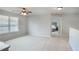 Upstairs loft area with plush carpeting and natural light at 868 Cork Oak Ln, Lawrenceville, GA 30045